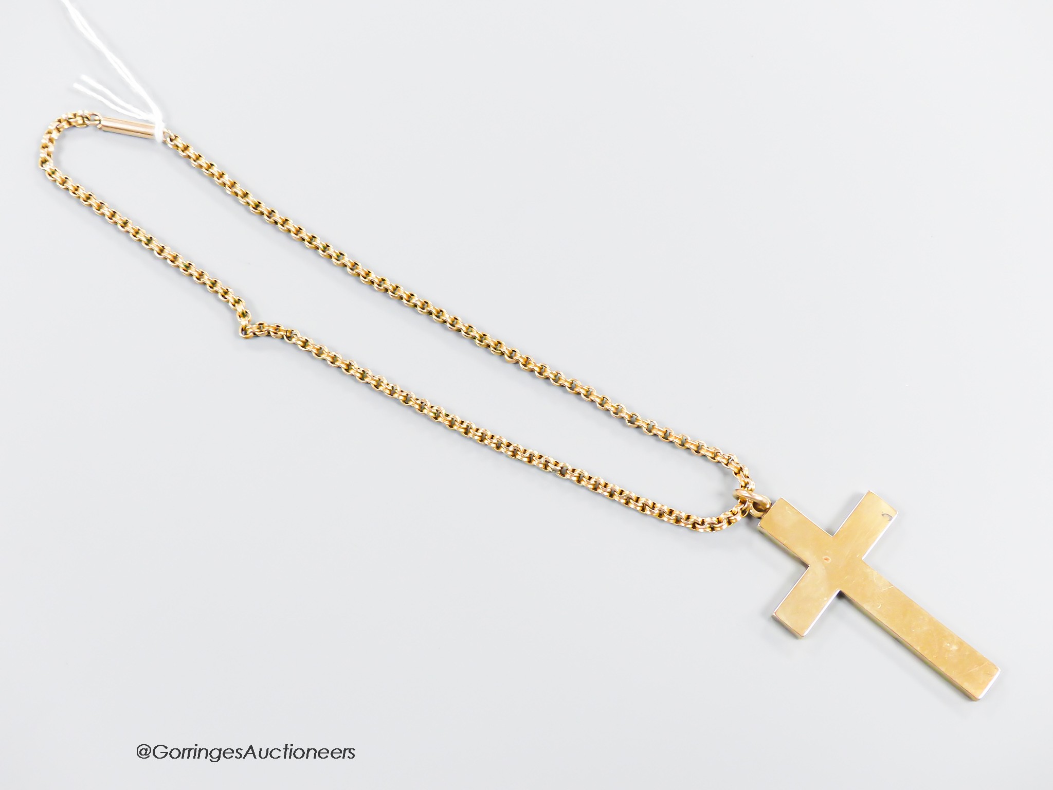 A hollow yellow metal cross pendant, 53mm, together with an Edwardian yellow metal choker chain, stamped 9c, 34cm